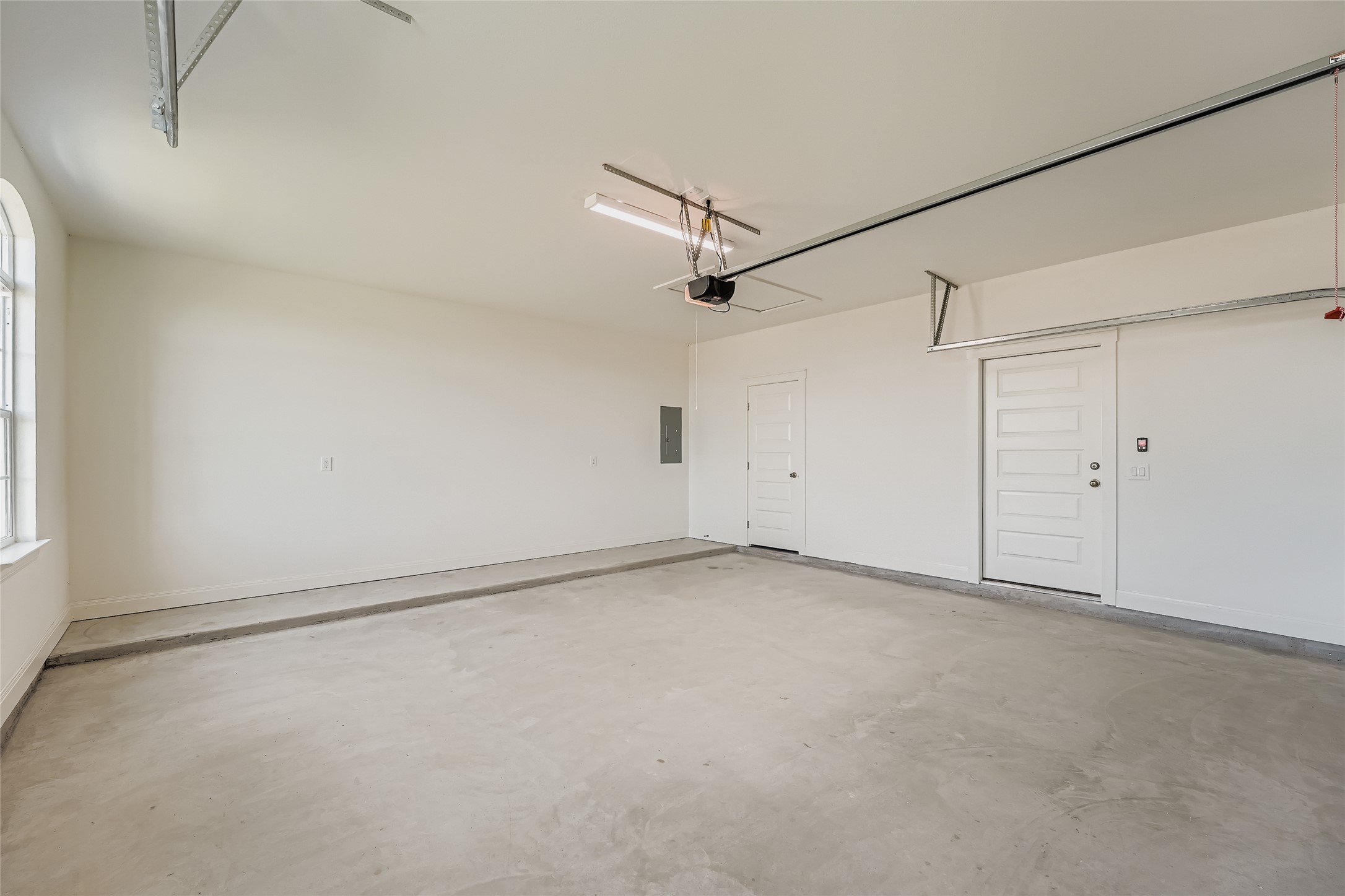 222 Arosa Drive Elgin, TX 78621 - Photo 36 of 40 wooden floor in an empty room with a window