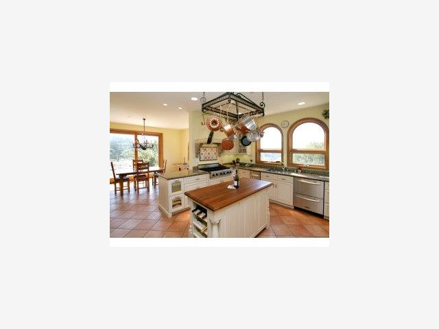 740 Skyward Drive Aptos, CA 95003 - Photo 6 of 9 a living room with furniture a table and kitchen view