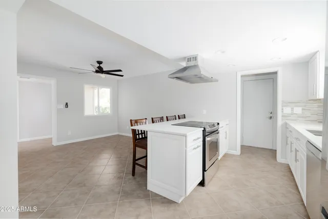 a kitchen with a stove and a sink