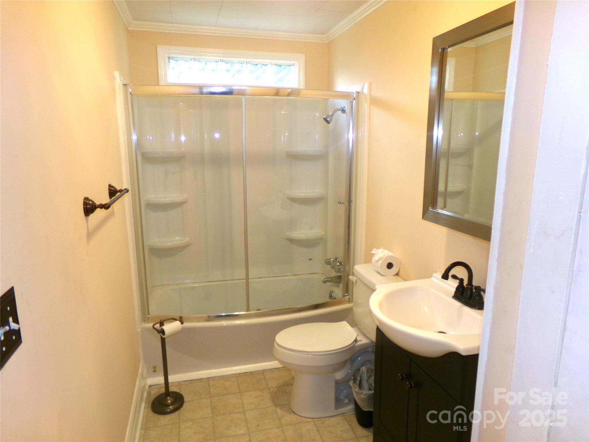 306 Dunlap Street Albemarle, NC 28001 - Photo 13 of 23 a bathroom with a sink a toilet and shower