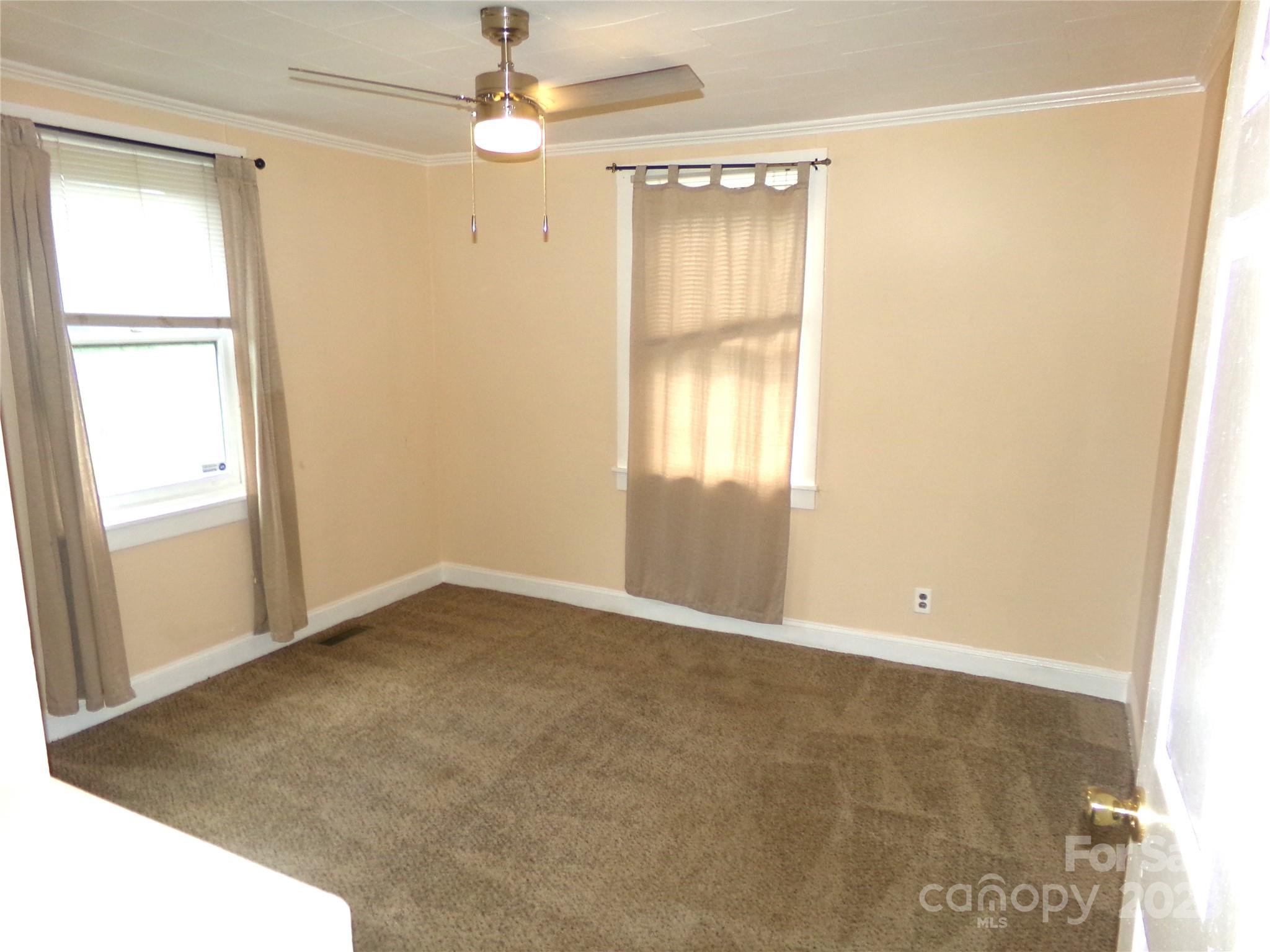 306 Dunlap Street Albemarle, NC 28001 - Photo 14 of 23 an empty room with windows and closet
