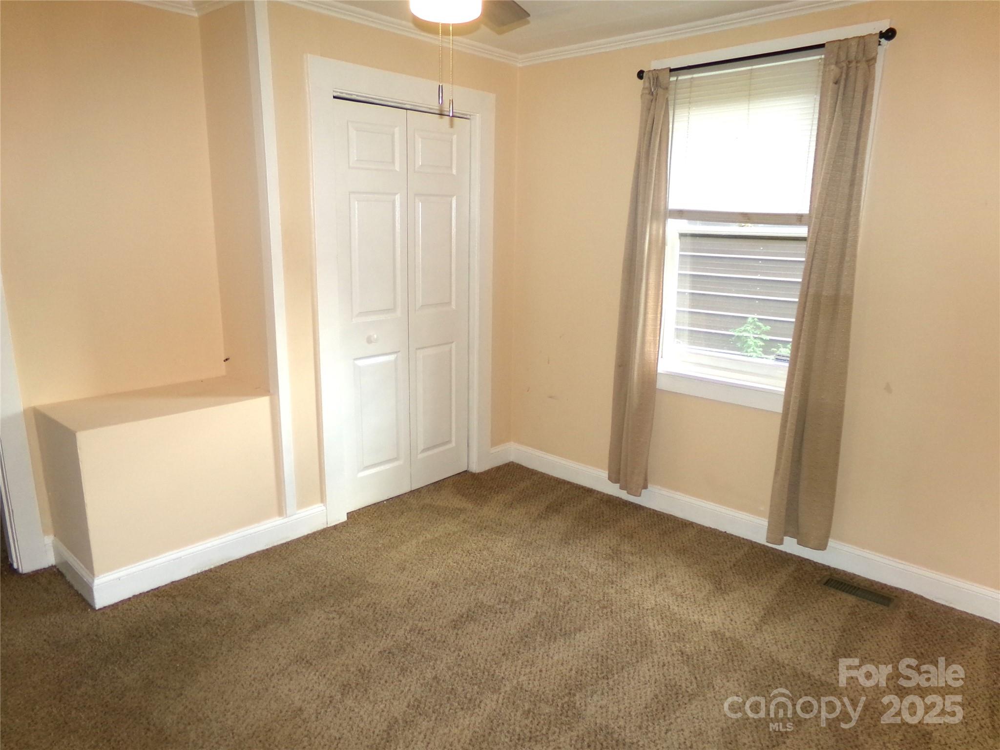 306 Dunlap Street Albemarle, NC 28001 - Photo 15 of 23 a view of an empty room with a window