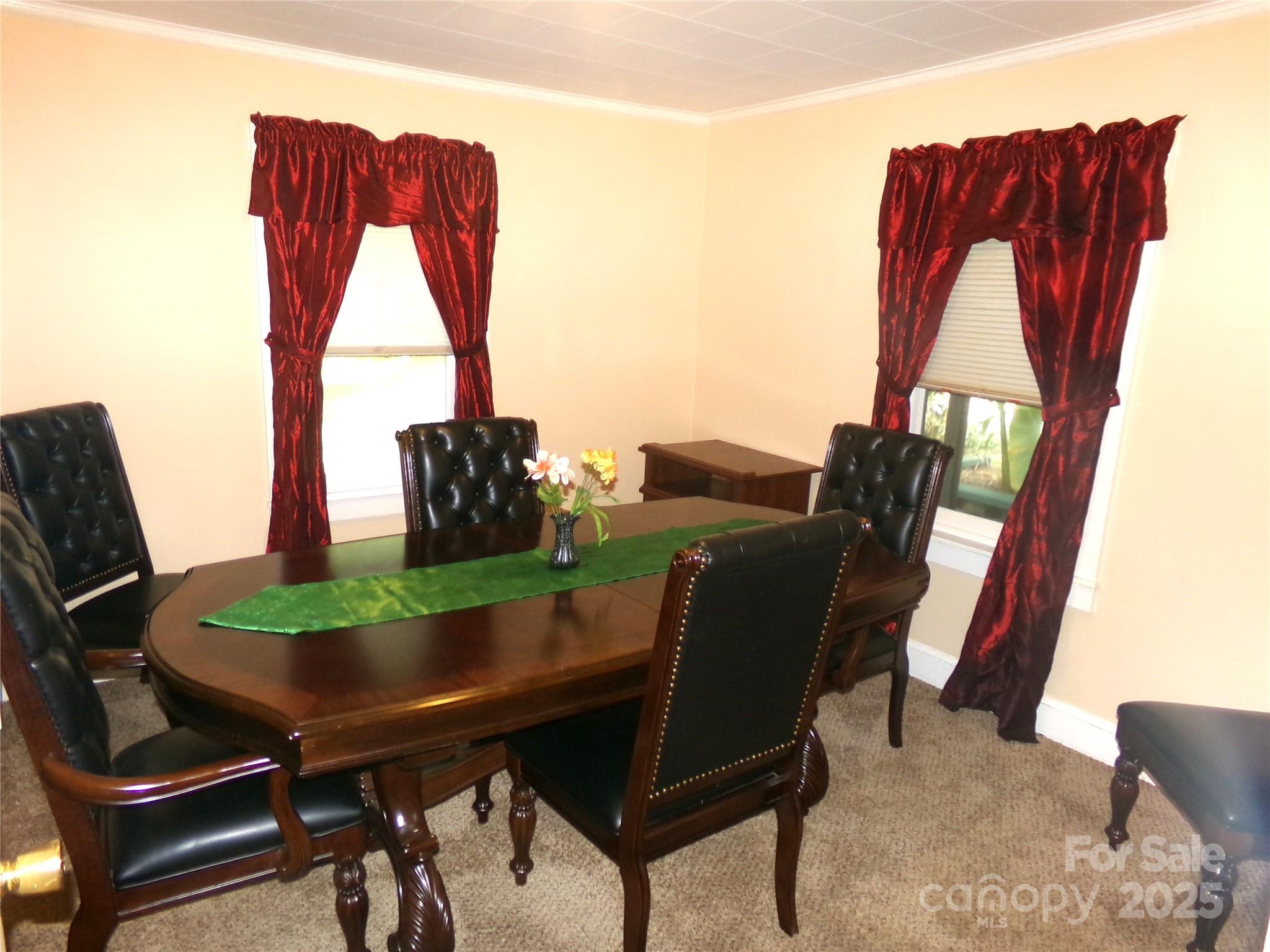 306 Dunlap Street Albemarle, NC 28001 - Photo 16 of 23 a view of a dining room with furniture and window
