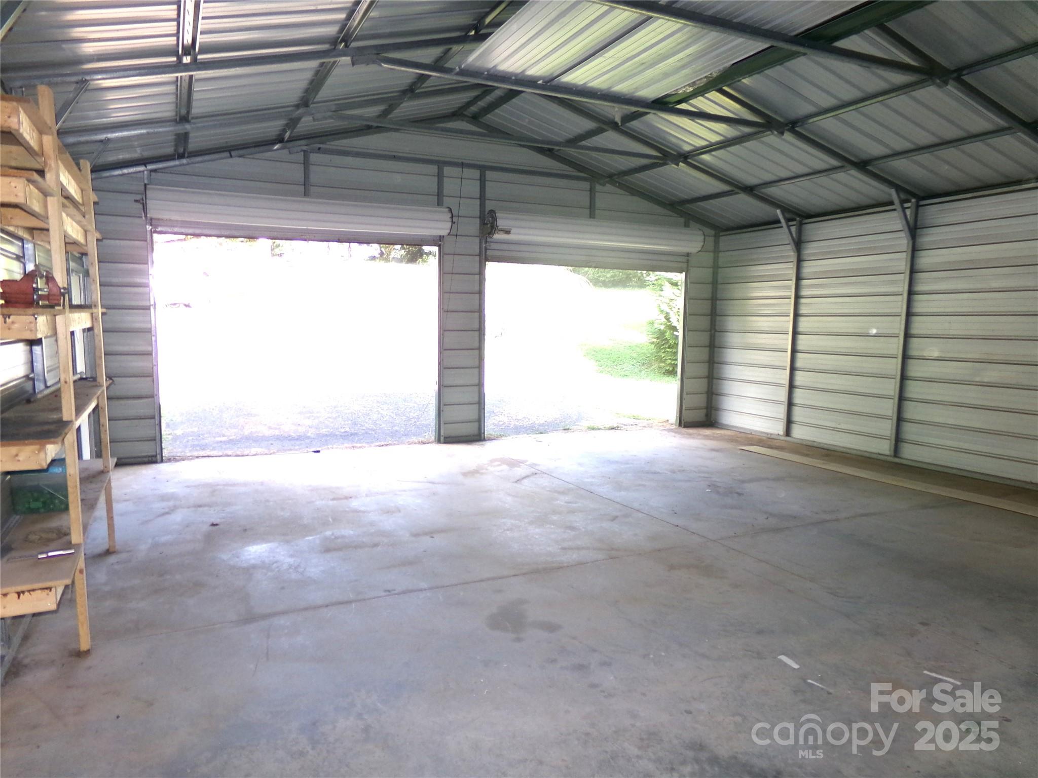306 Dunlap Street Albemarle, NC 28001 - Photo 22 of 23 a view of an empty room with a fireplace and a window