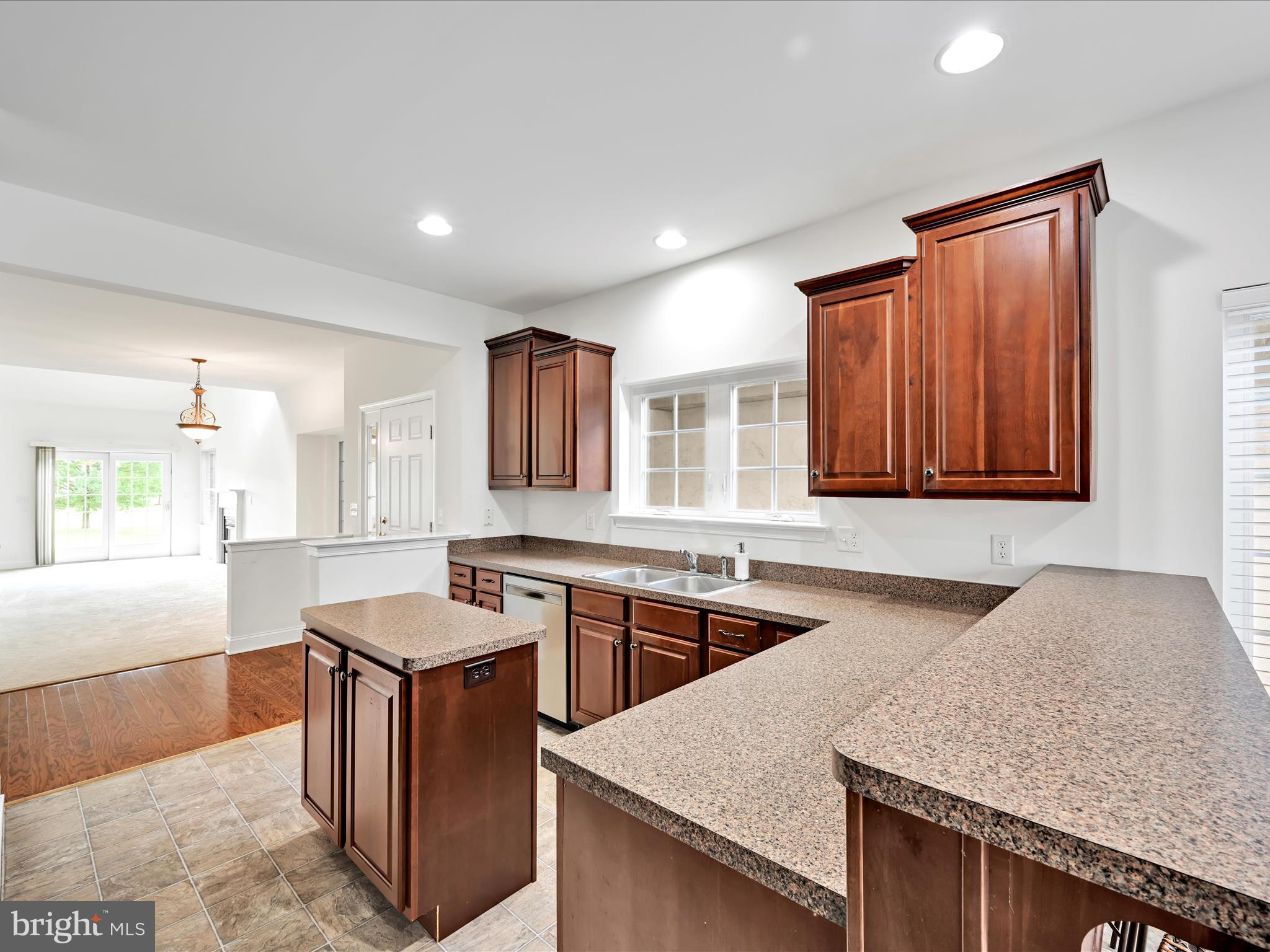 660 Woodfield Drive Lititz, PA 17543 - Photo 11 of 43 a kitchen with stainless steel appliances granite countertop wooden cabinets a sink and dishwasher