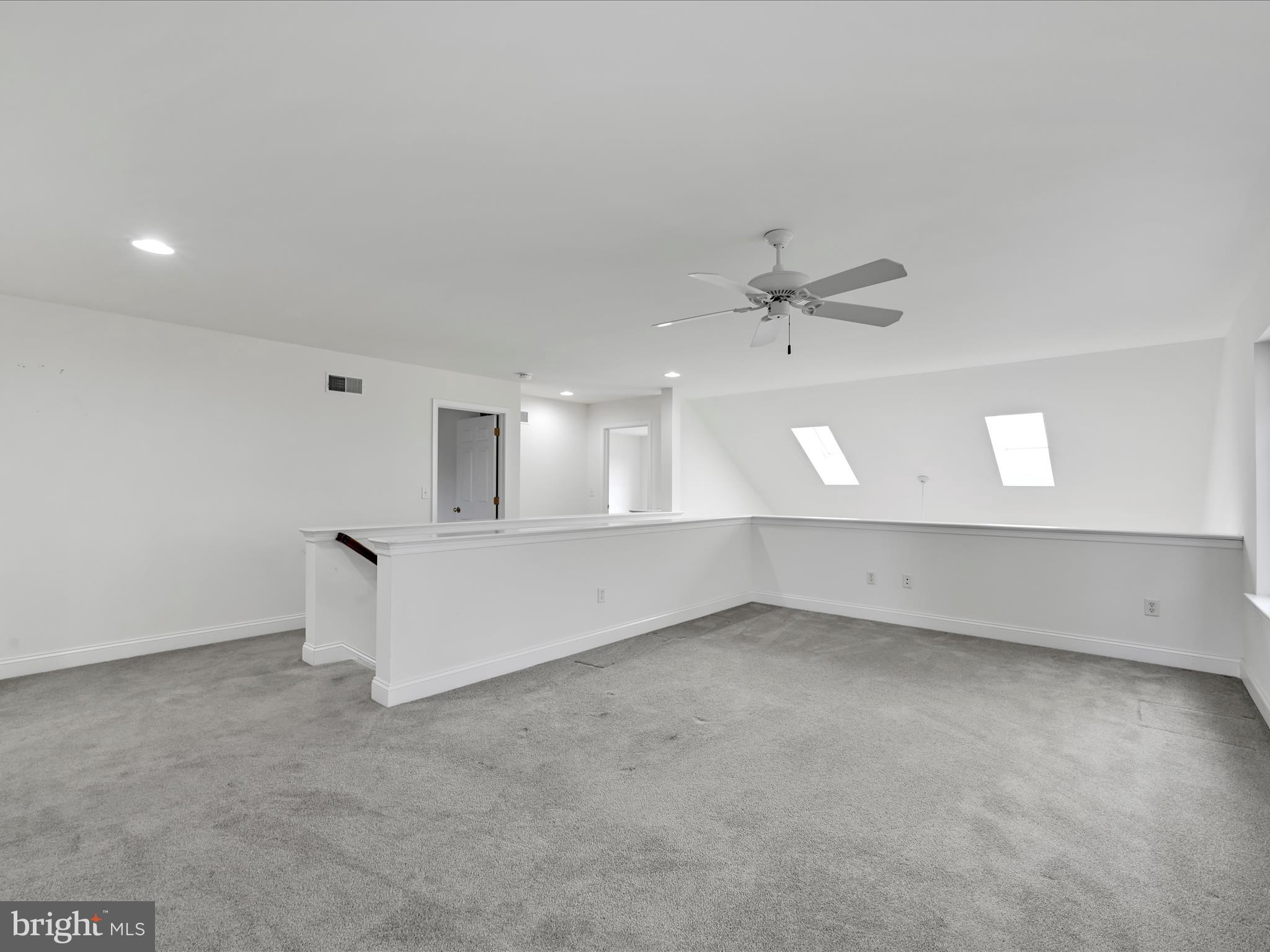 660 Woodfield Drive Lititz, PA 17543 - Photo 21 of 43 an empty room with a ceiling fan and window