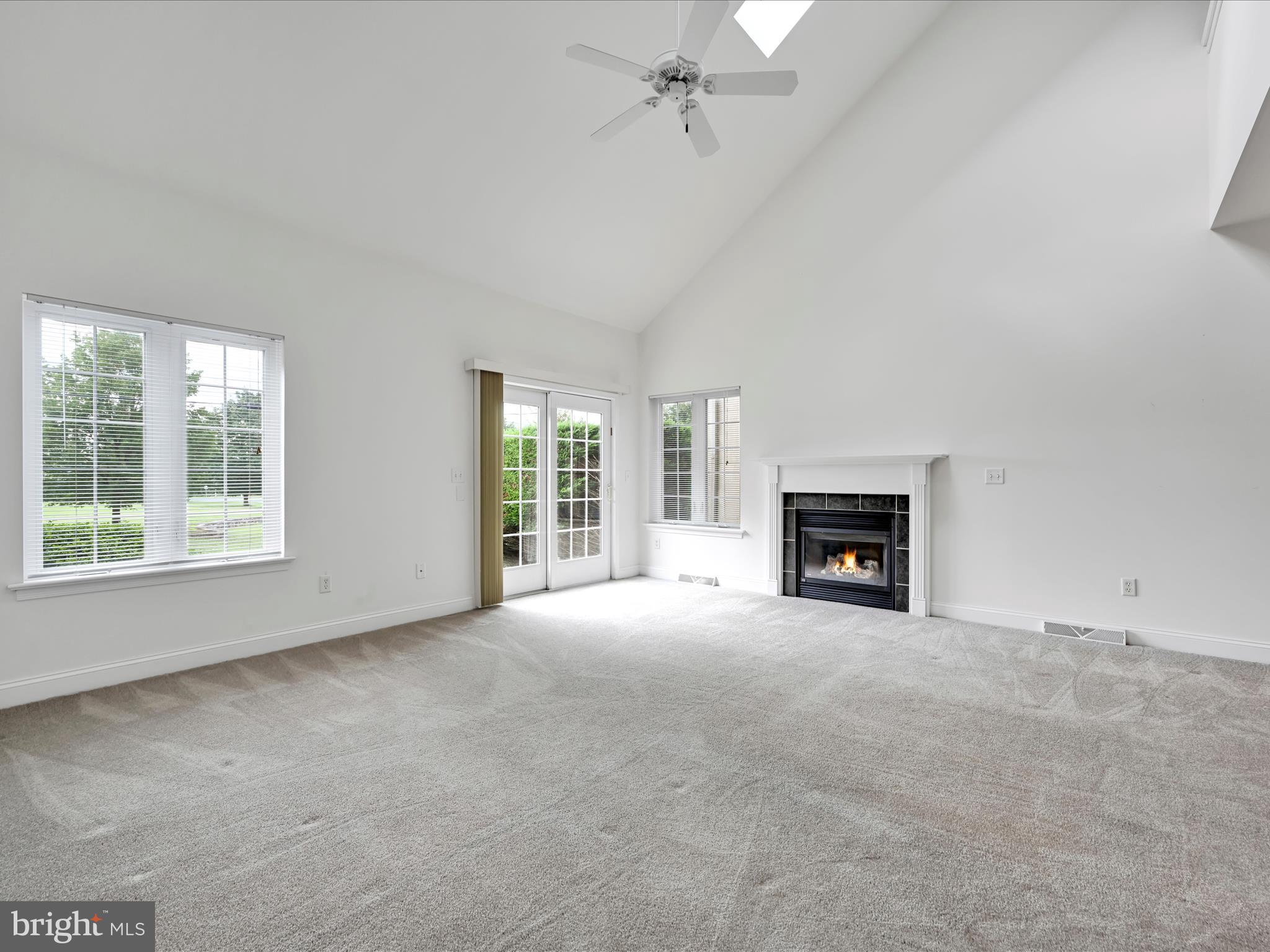 660 Woodfield Drive Lititz, PA 17543 - Photo 4 of 43 an empty room with windows and fireplace