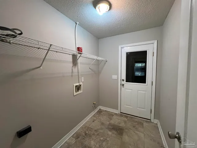 a view of a porch with a table and chairs