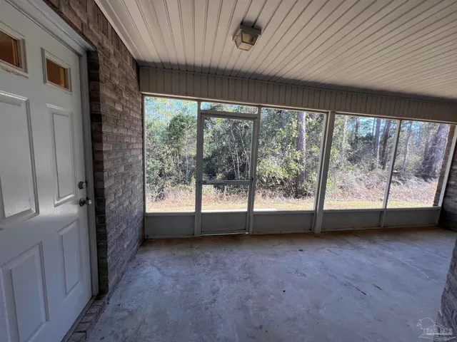 a bathroom with a granite countertop sink mirror vanity and toilet