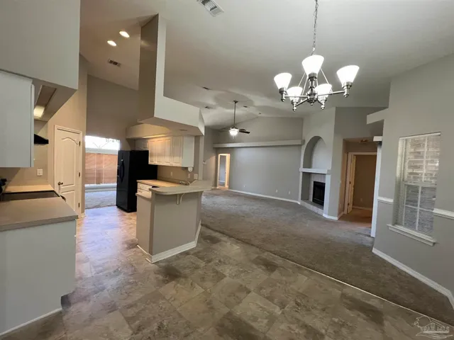 a view of a kitchen with a sink stainless steel appliances and cabinets