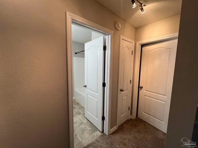 a view of a hallway with closet