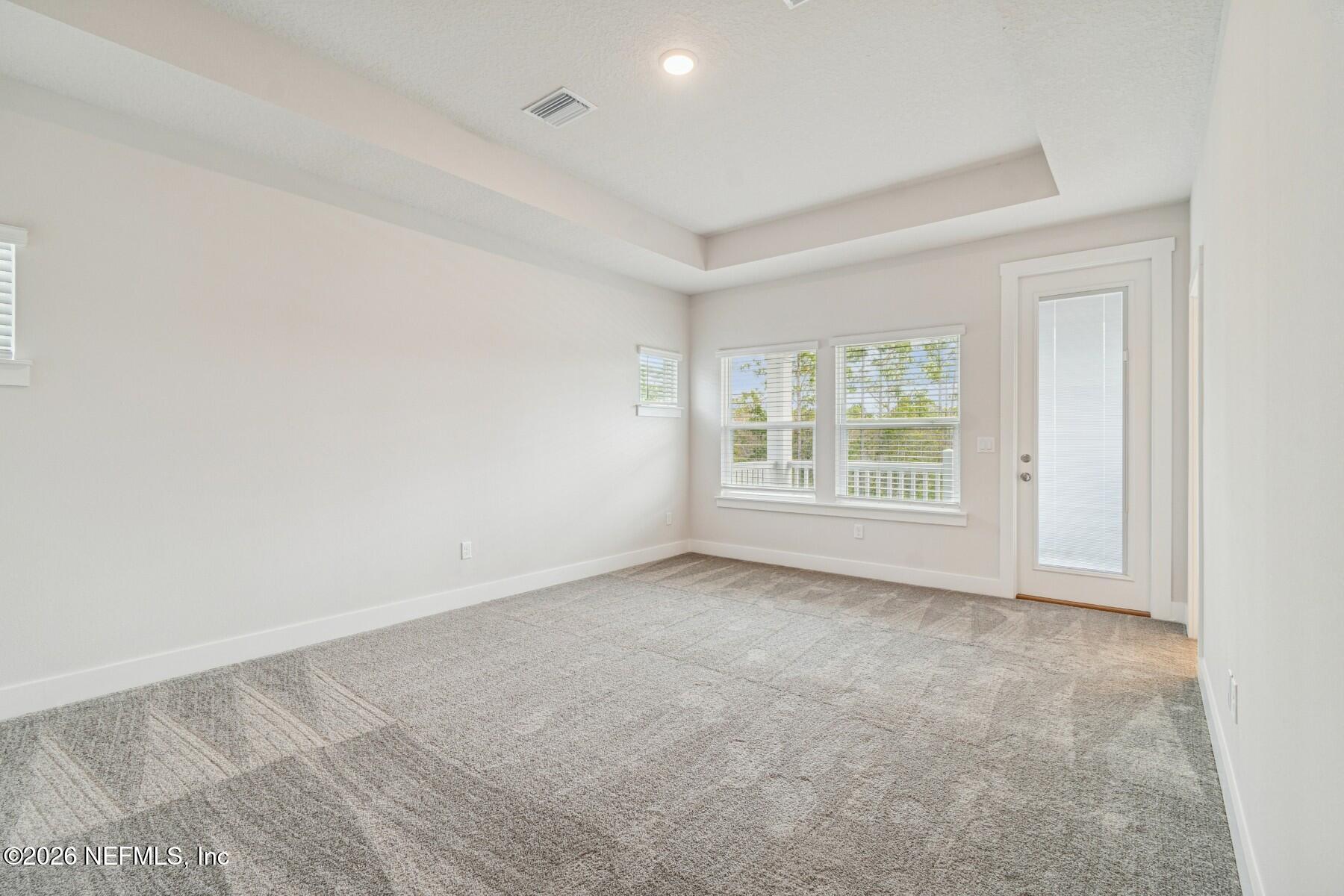 10131 Element Road Jacksonville, FL 32256 - Photo 17 of 28 an empty room with windows