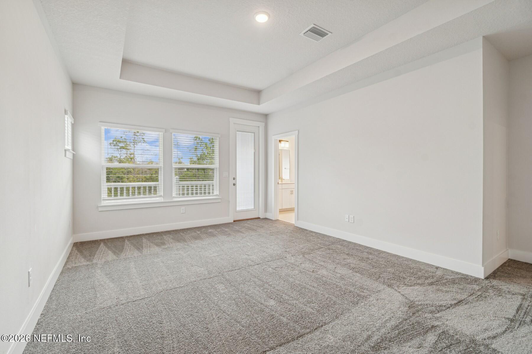 10131 Element Road Jacksonville, FL 32256 - Photo 19 of 28 a view of an empty room with a window