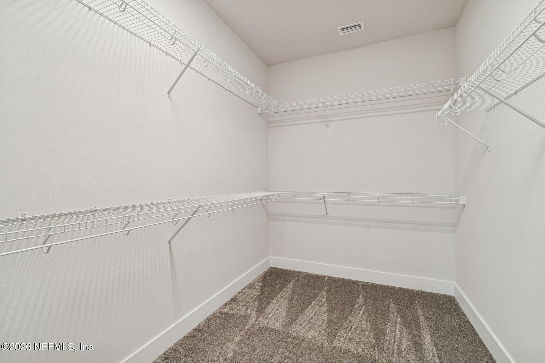 10131 Element Road Jacksonville, FL 32256 - Photo 21 of 28 a view of a room with racks on the wall