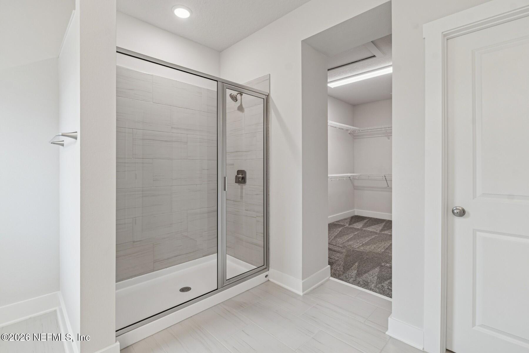 10131 Element Road Jacksonville, FL 32256 - Photo 24 of 28 a bathroom with a shower