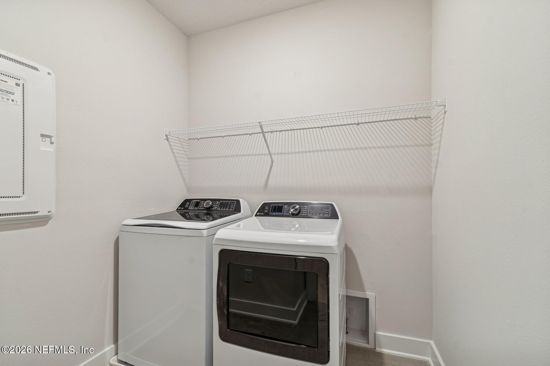10131 Element Road Jacksonville, FL 32256 - Photo 25 of 28 a utility room with dryer and washer