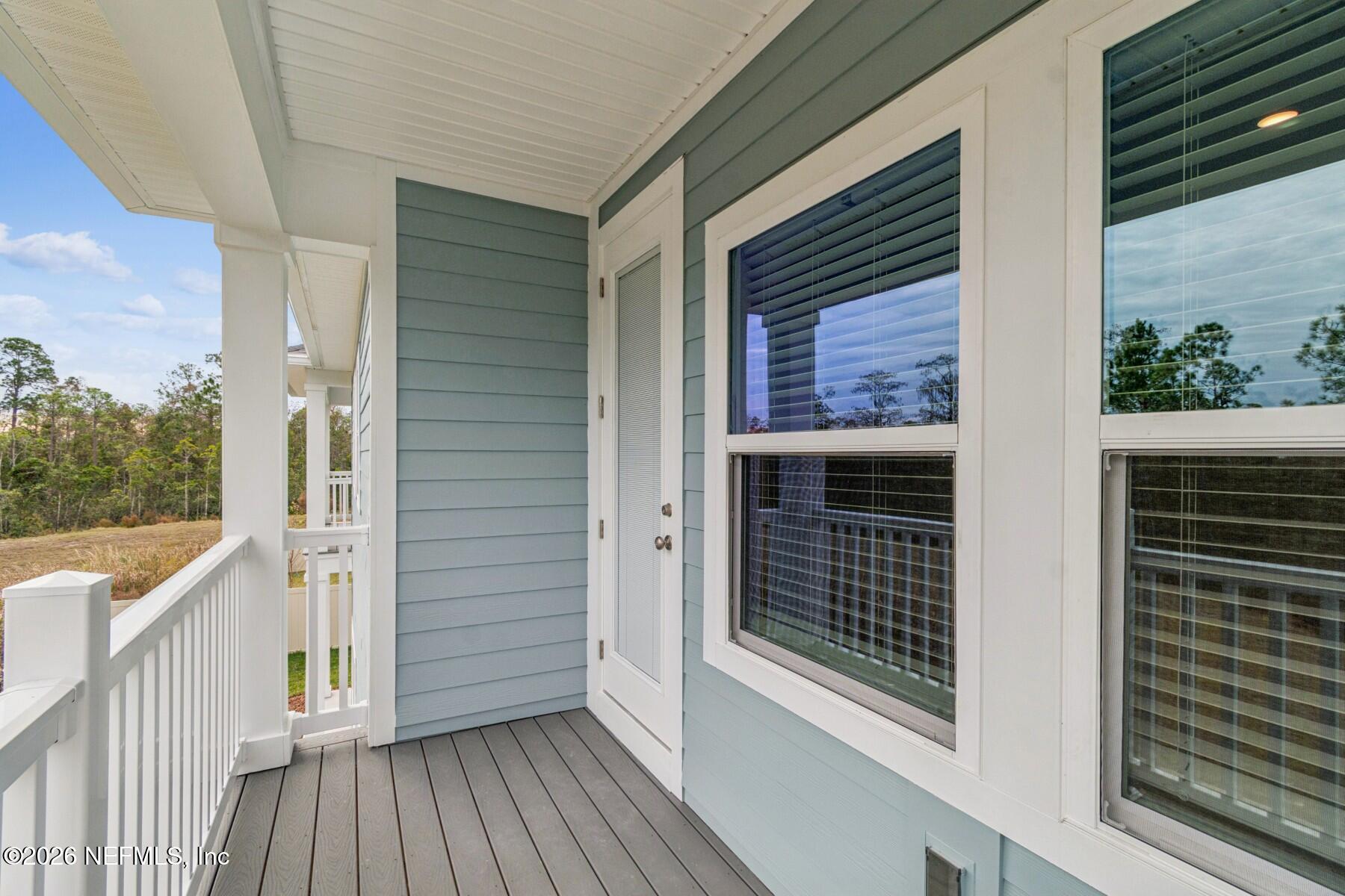 10131 Element Road Jacksonville, FL 32256 - Photo 26 of 28 a view of a balcony with wooden floor and fence