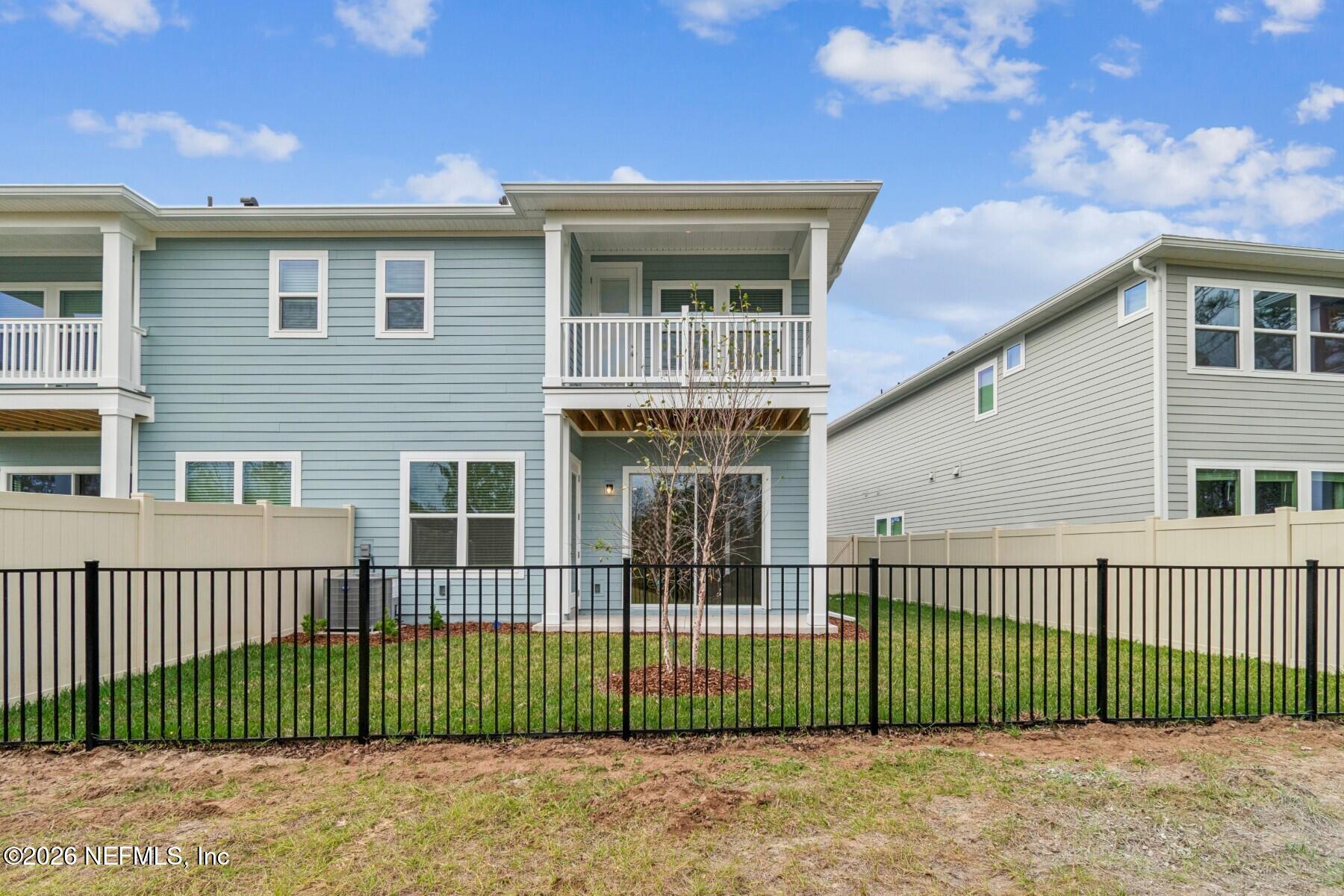 10131 Element Road Jacksonville, FL 32256 - Photo 28 of 28 a view of a house with a fence