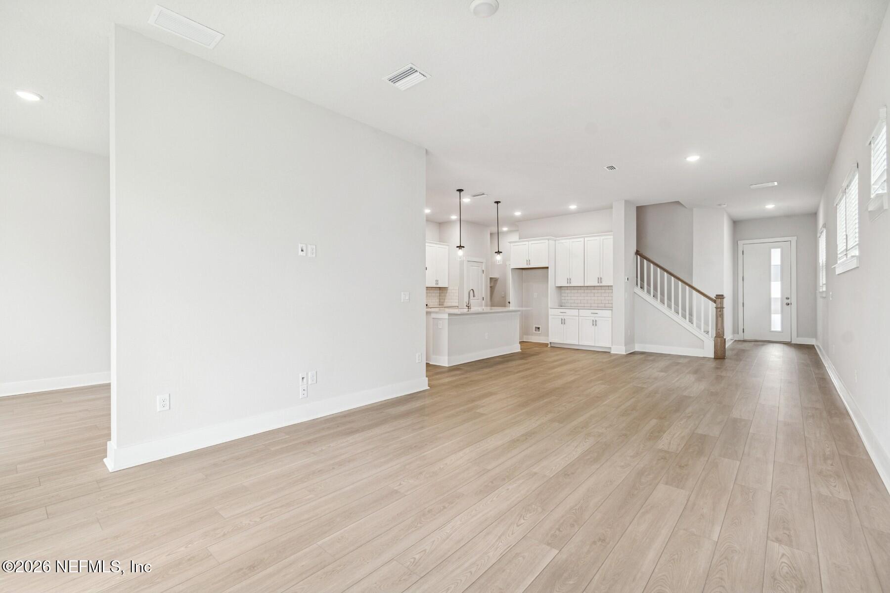 10131 Element Road Jacksonville, FL 32256 - Photo 7 of 28 a view of a kitchen with a sink and a refrigerator