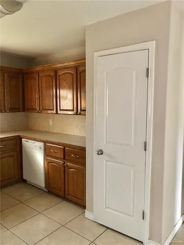 a kitchen with white cabinets
