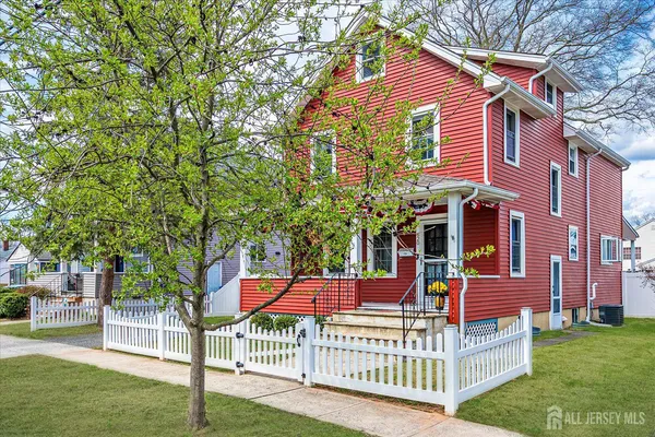 a view of a house with a yard and deck