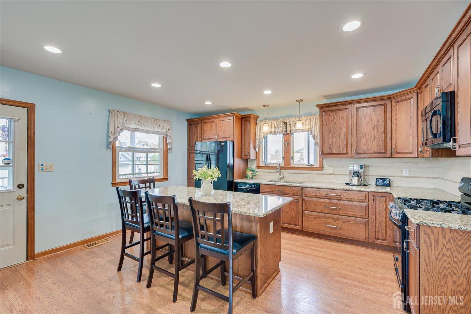 620 Dunellen Avenue Dunellen, NJ 08812 - Photo 13 of 48 a kitchen with a table and chairs in it