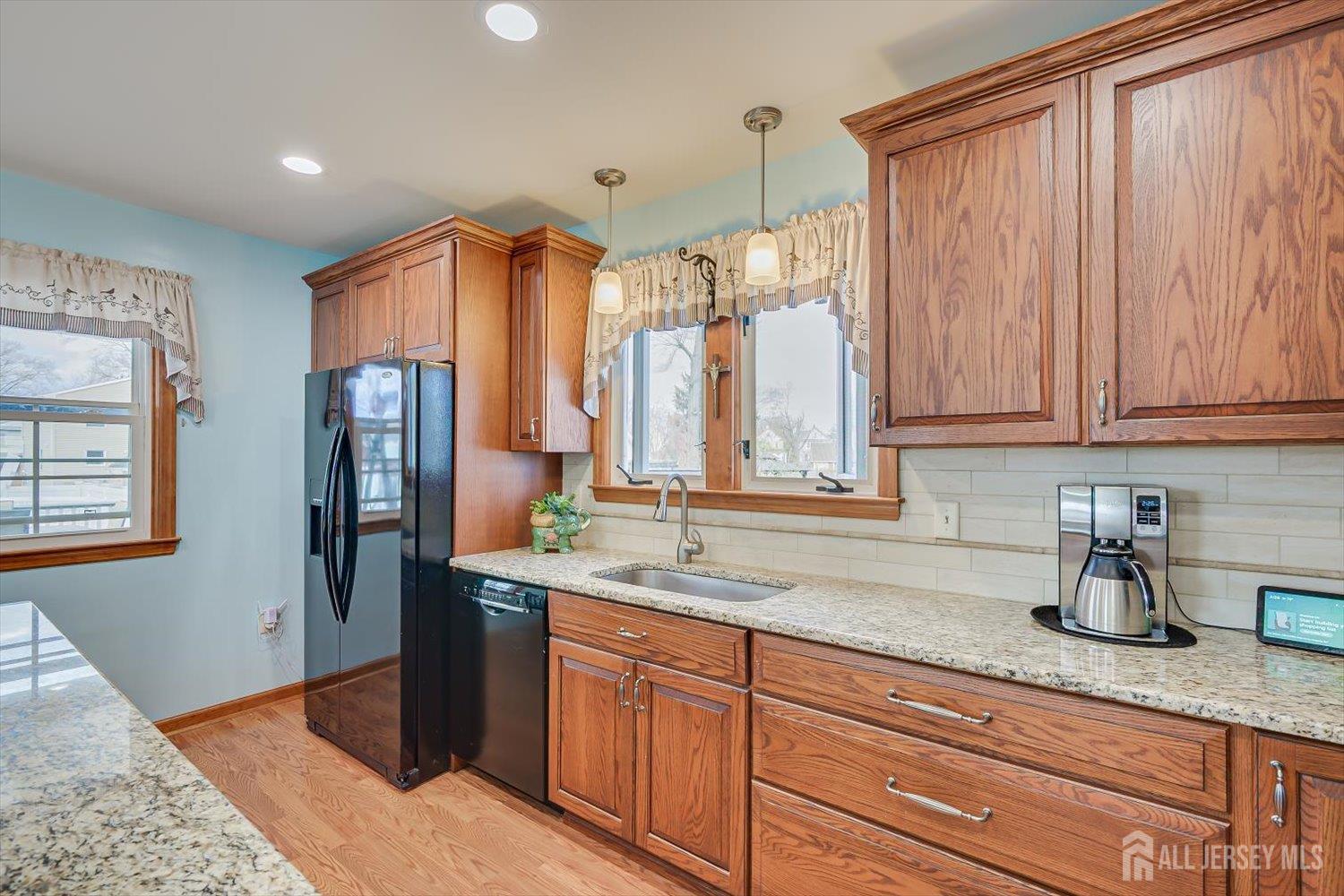 620 Dunellen Avenue Dunellen, NJ 08812 - Photo 15 of 48 a kitchen with stainless steel appliances granite countertop a refrigerator and a sink