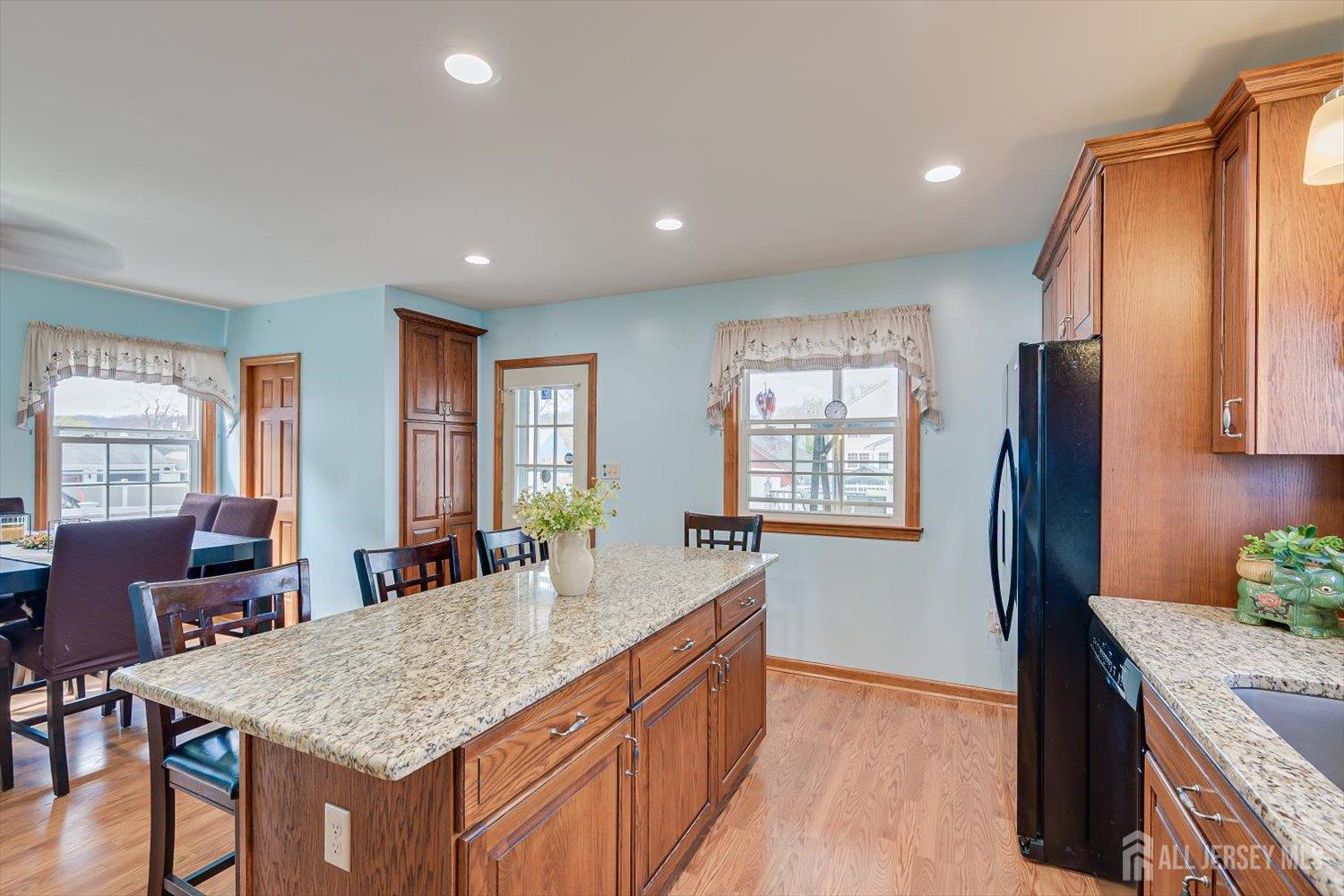 620 Dunellen Avenue Dunellen, NJ 08812 - Photo 16 of 48 a kitchen with stainless steel appliances granite countertop sink refrigerator and window