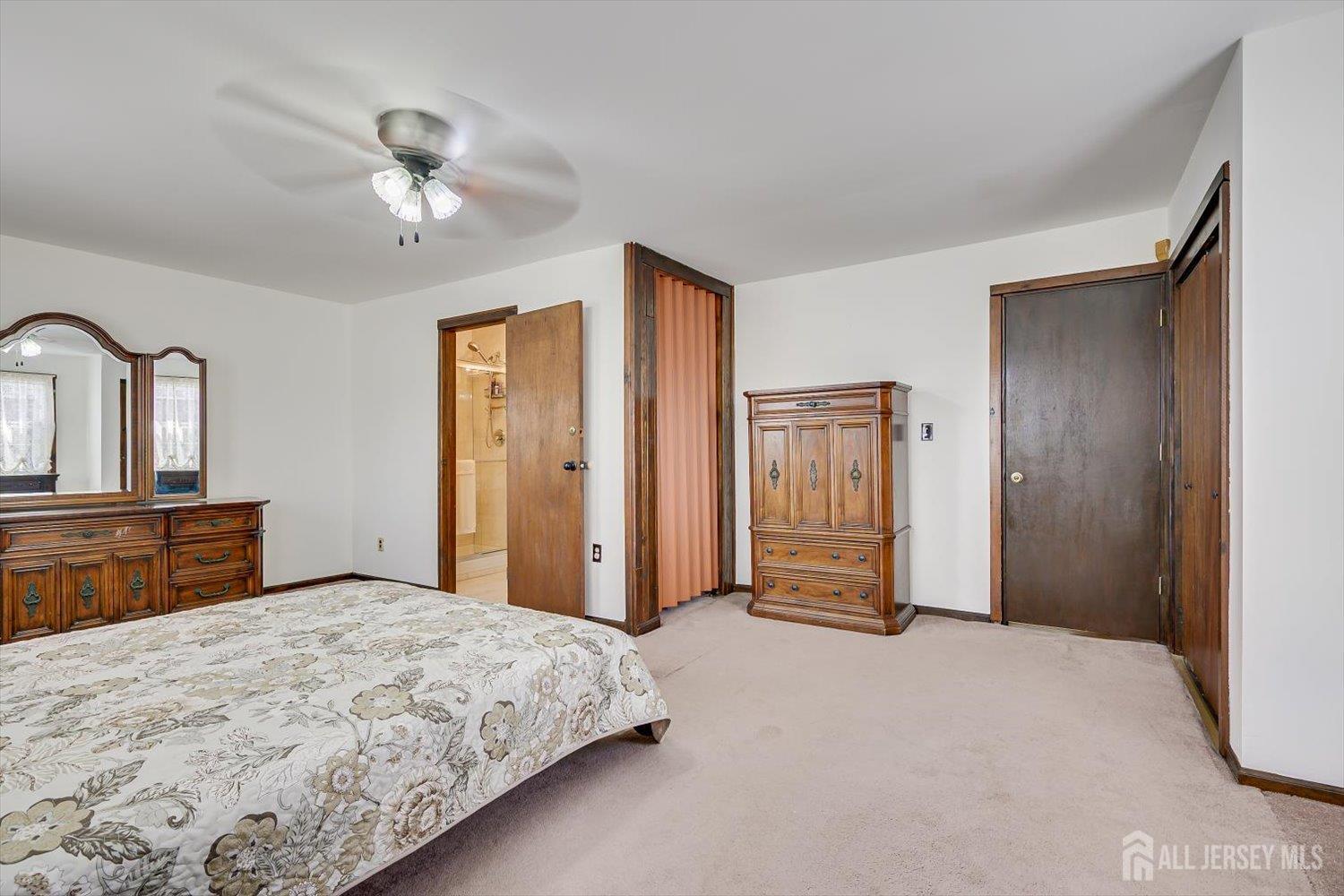 620 Dunellen Avenue Dunellen, NJ 08812 - Photo 22 of 48 a bedroom with a large bed and closet