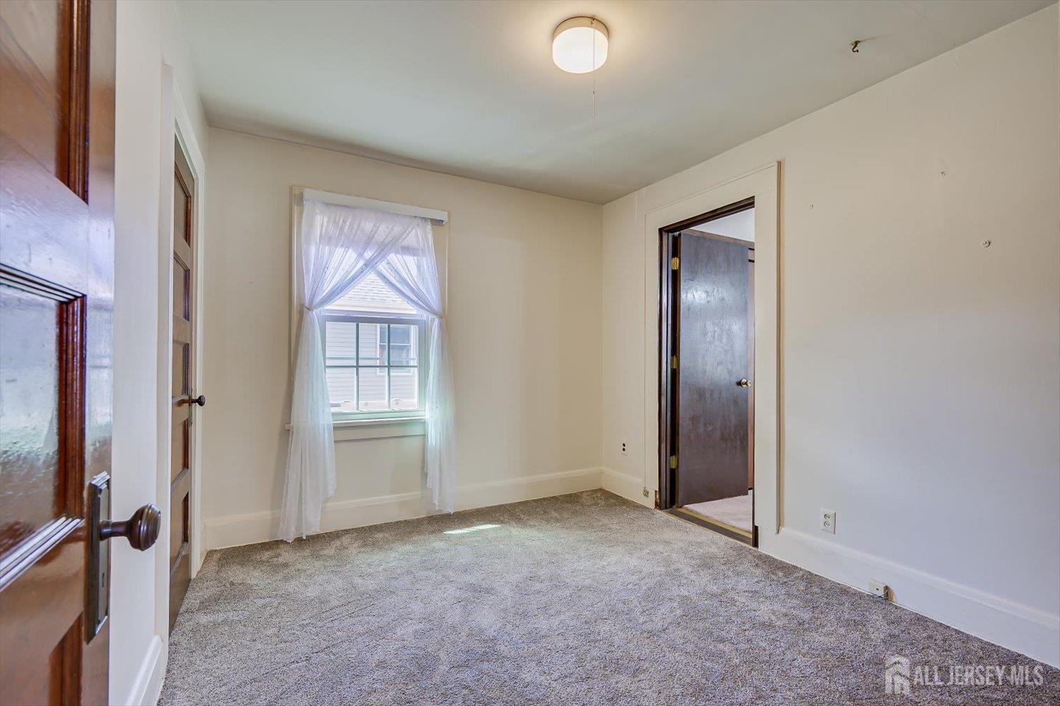 620 Dunellen Avenue Dunellen, NJ 08812 - Photo 26 of 48 an empty room with windows and closet