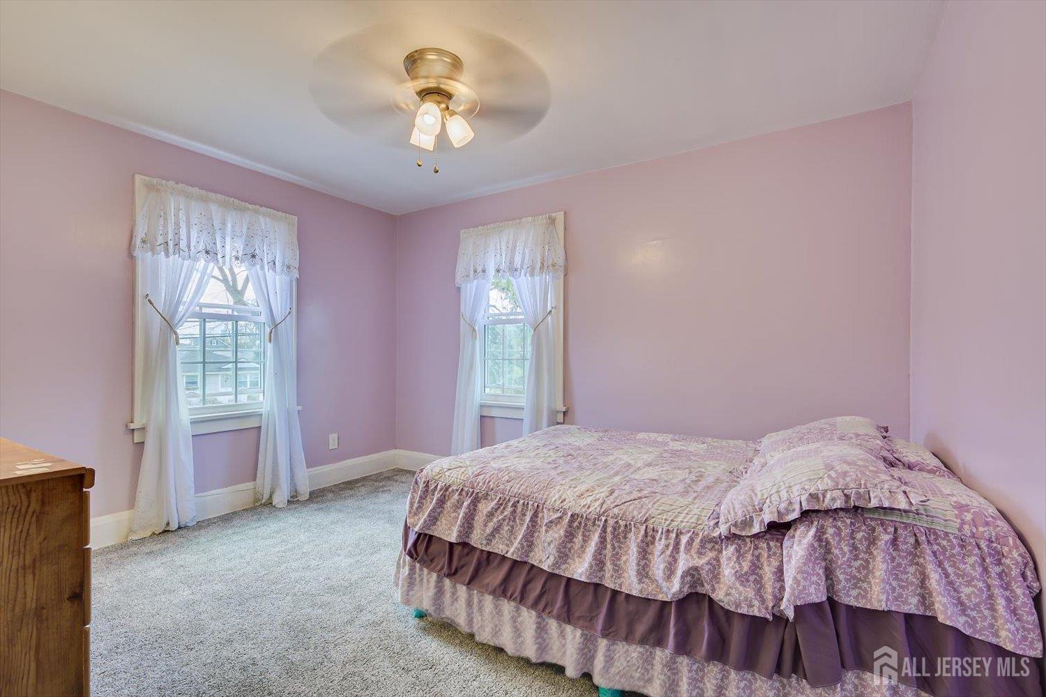 620 Dunellen Avenue Dunellen, NJ 08812 - Photo 28 of 48 a bedroom with a bed and a chandelier