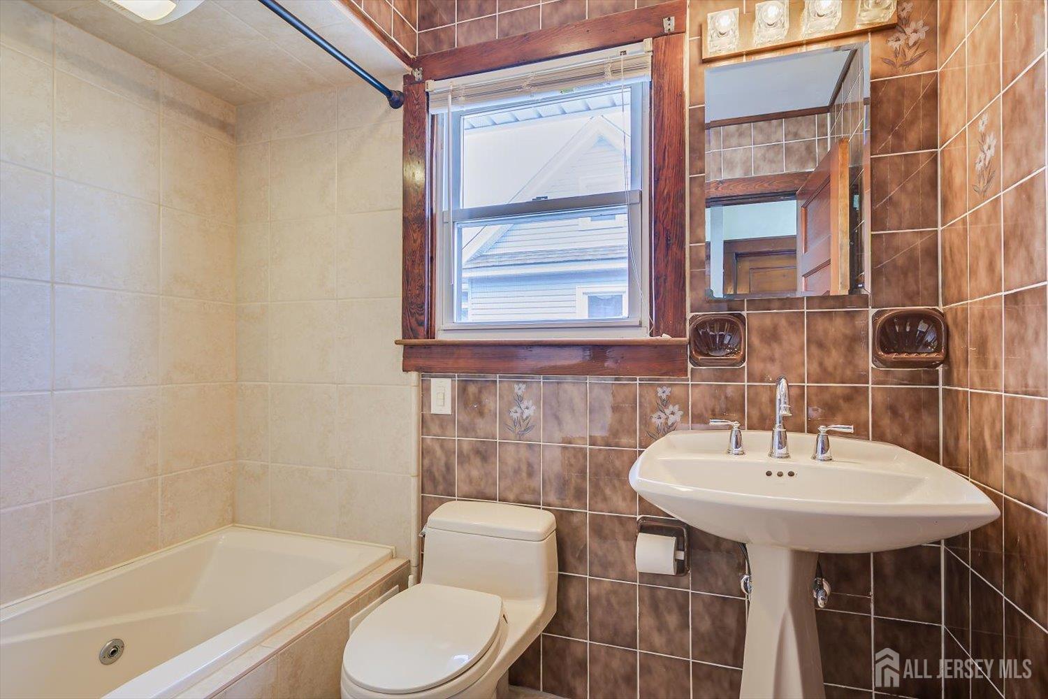 620 Dunellen Avenue Dunellen, NJ 08812 - Photo 29 of 48 a bathroom with a sink toilet and shower