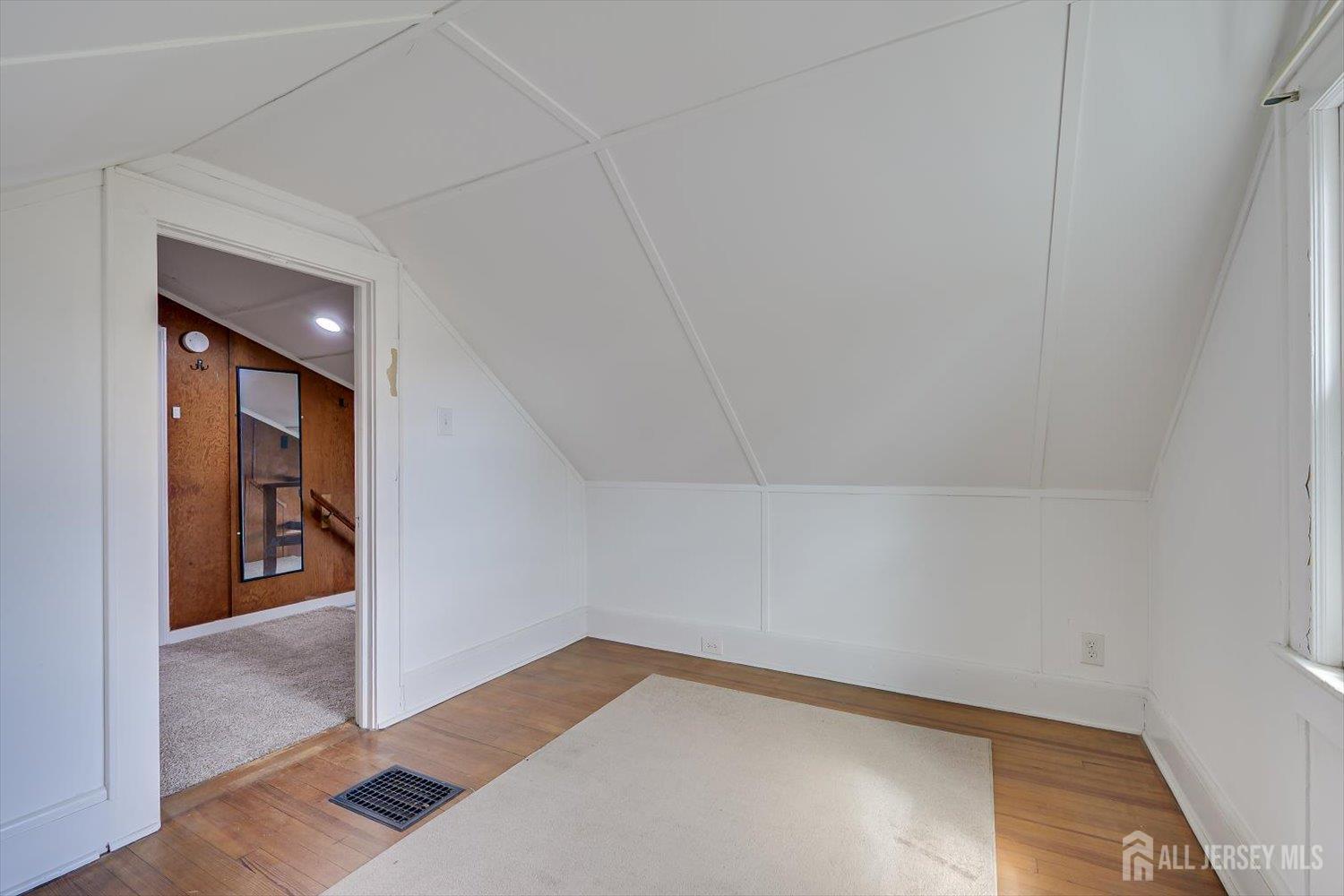 620 Dunellen Avenue Dunellen, NJ 08812 - Photo 36 of 48 a view of a room with wooden floor and hallway