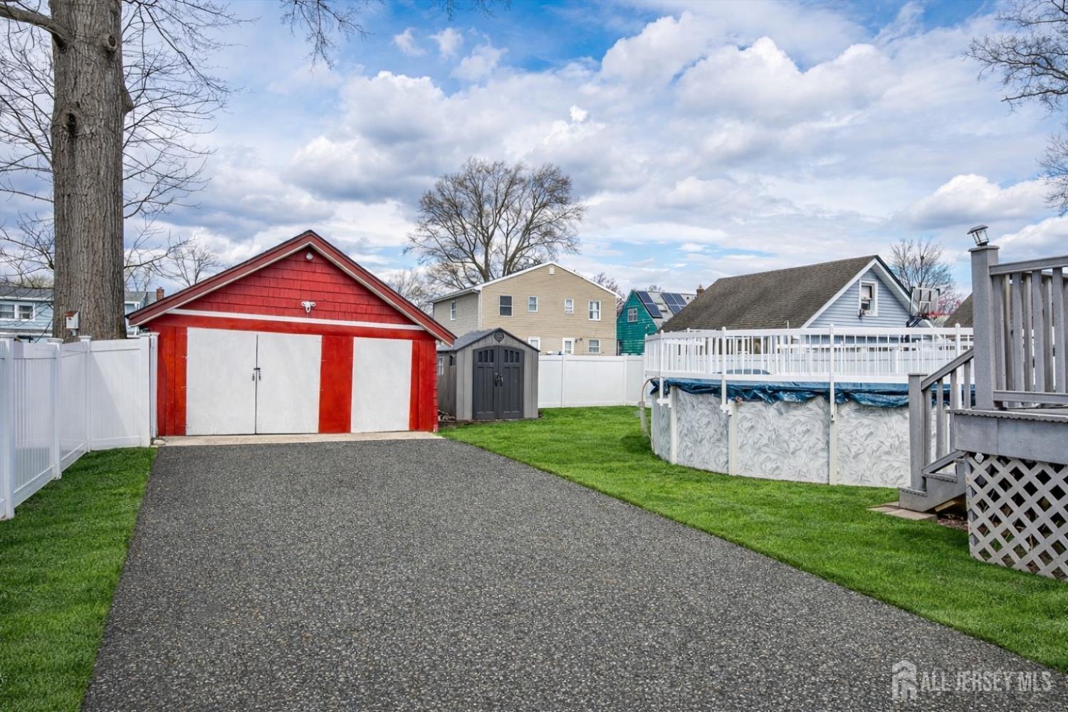 620 Dunellen Avenue Dunellen, NJ 08812 - Photo 43 of 48 a front view of a house with a yard and garage