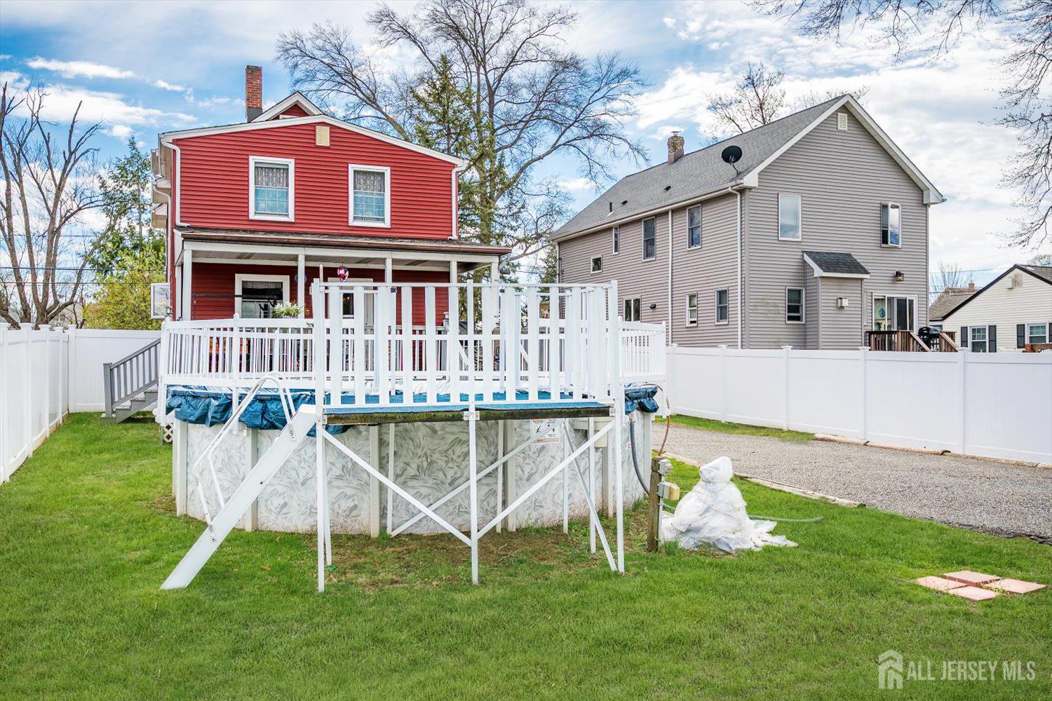 620 Dunellen Avenue Dunellen, NJ 08812 - Photo 48 of 48 a view of a house with a yard deck and a slide