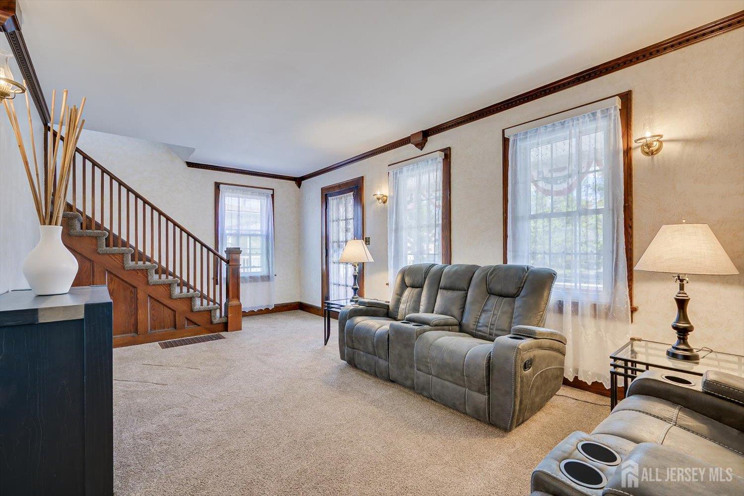 620 Dunellen Avenue Dunellen, NJ 08812 - Photo 5 of 48 a living room with furniture and a lamp