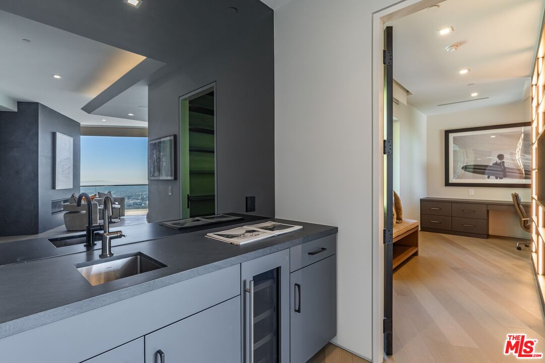 1895 Rising Glen Road Los Angeles, CA 90069 - Photo 13 of 41 a kitchen with sink refrigerator and window