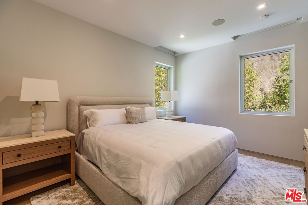 1895 Rising Glen Road Los Angeles, CA 90069 - Photo 21 of 41 a bedroom with a bed and a window