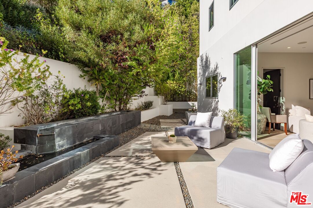 1895 Rising Glen Road Los Angeles, CA 90069 - Photo 28 of 41 a view of a patio in the backyard
