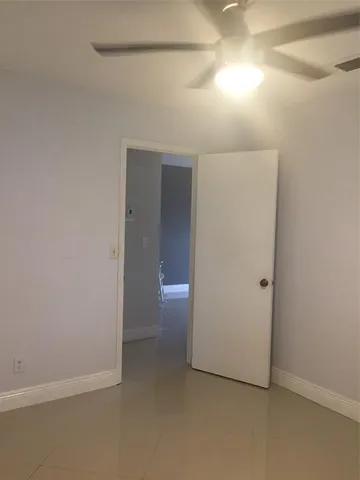 an empty room with a bathroom