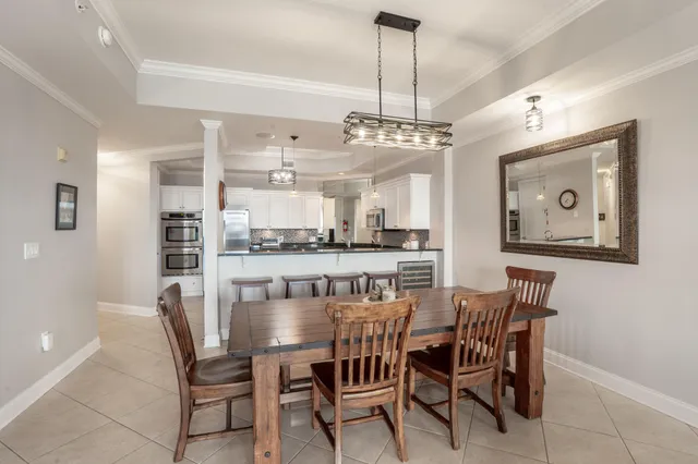 a kitchen with stainless steel appliances kitchen island granite countertop a refrigerator and a stove top oven