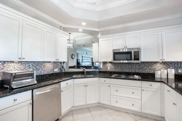 a bedroom with a bed and a lamp next to a window
