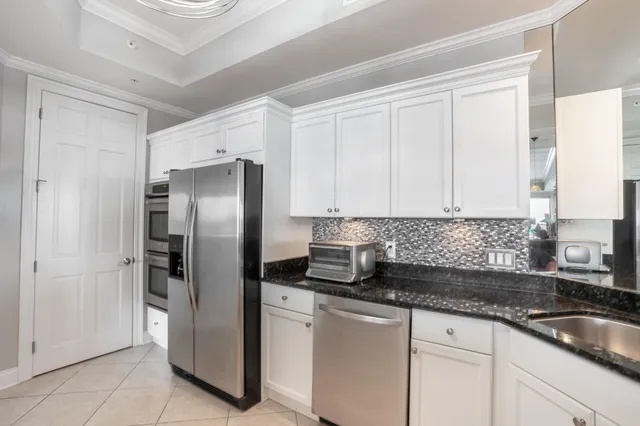 a bedroom with a bed and ceiling fan