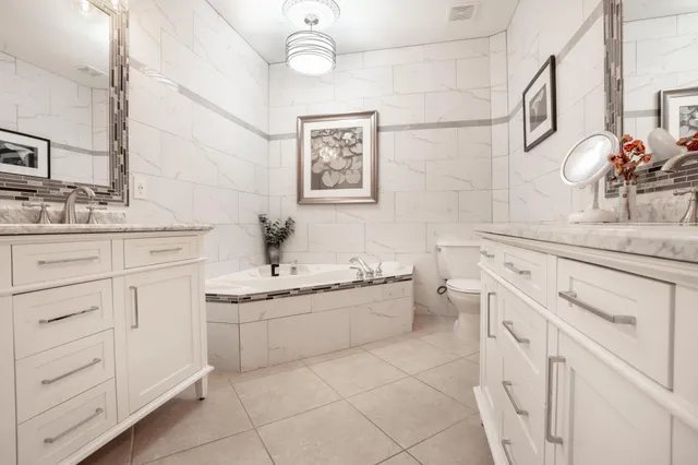 a view of a balcony with chairs and a table