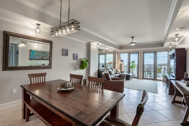a kitchen with granite countertop white cabinets stainless steel appliances and a sink