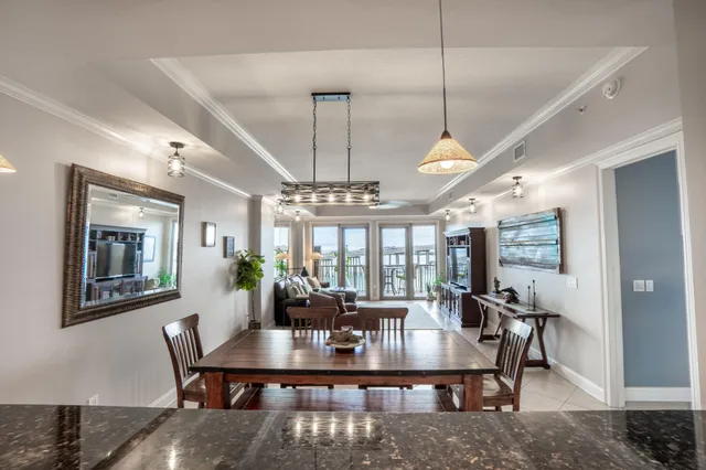 a kitchen with stainless steel appliances granite countertop a sink a stove and a granite counter tops