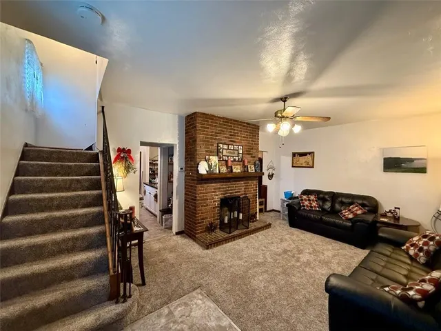 a bedroom with furniture and a fireplace
