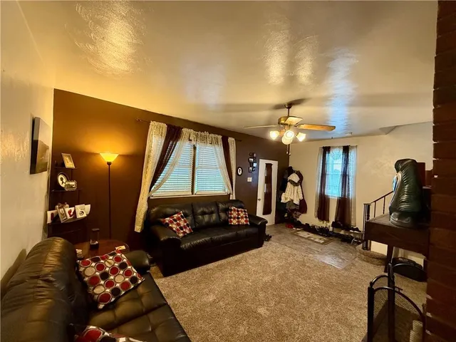 a bedroom with furniture and a window