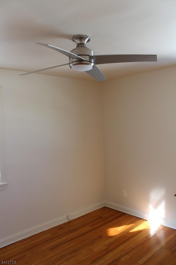 364 Orange Road, Unit B18 Montclair, NJ 07042 - Photo 7 of 9 a view of an empty room with wooden floor