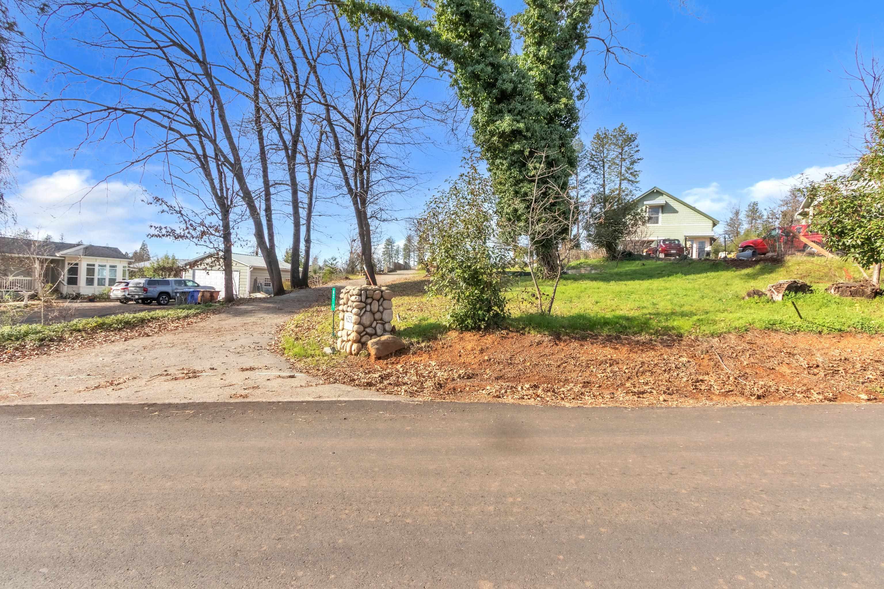 6251 Harvey Road Paradise, CA 95969 - Photo 26 of 48 a view of large house with a yard and sitting area